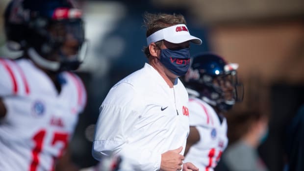 Mississippi head coach Lane Kiffin race up the field with his players before the game against Vanderbilt at Vanderbilt Stadium Saturday, Oct. 31, 2020 in Nashville, Tenn. (George Walker IV / Tennessean.com)